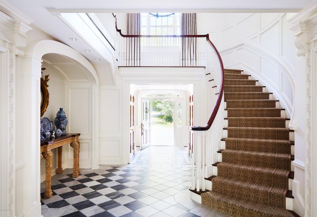 a view of entryway with wooden floor and stairs