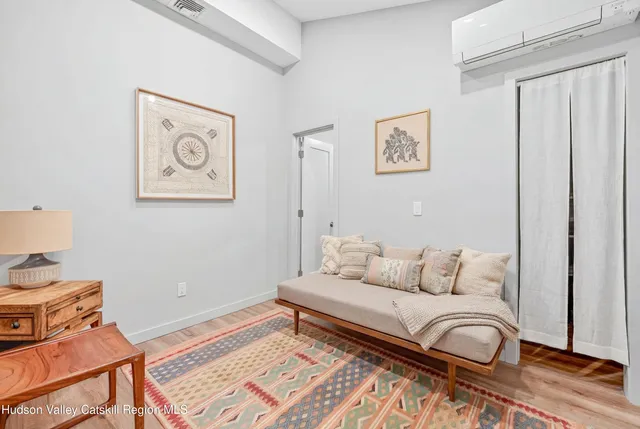 a bedroom with a bed and cupboard