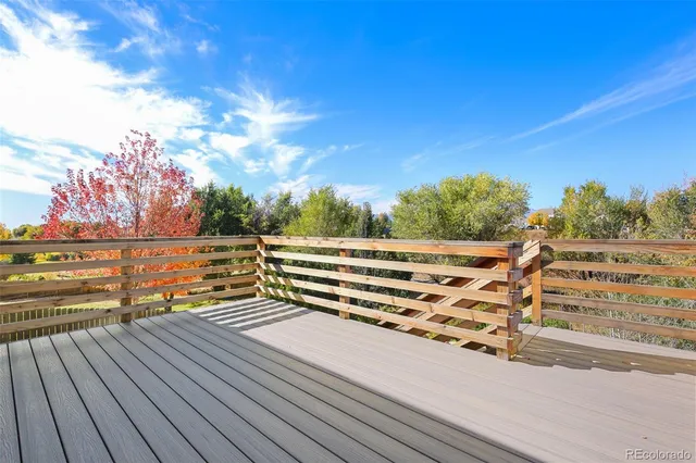 a view of outdoor space with deck and white building