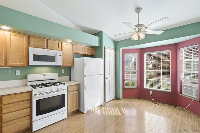 a kitchen with stainless steel appliances a stove cabinets and a refrigerator