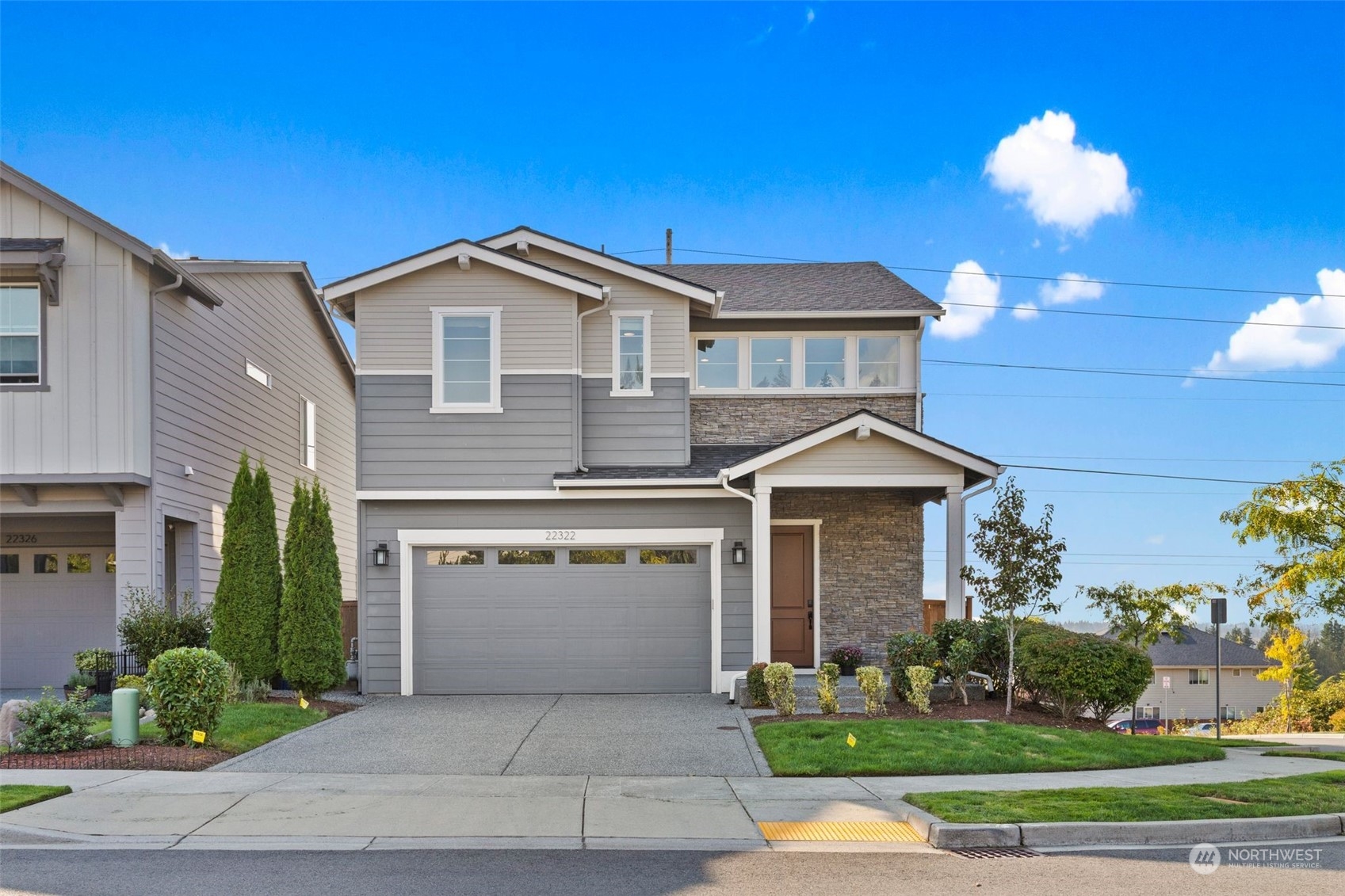 22322 43rd Drive Southeast Bothell, WA 98021 - Photo 1 of 40 a front view of a house with a yard and garage