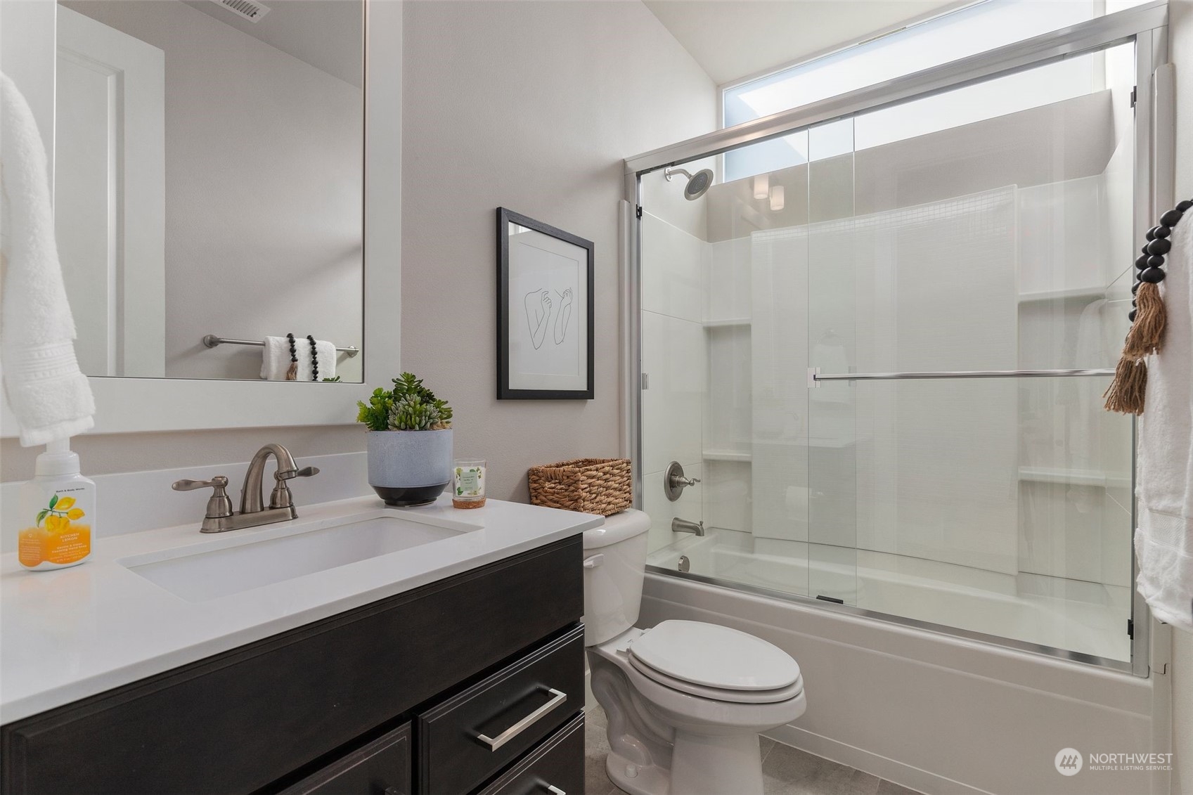 22322 43rd Drive Southeast Bothell, WA 98021 - Photo 17 of 40 a bathroom with a sink a toilet and a mirror