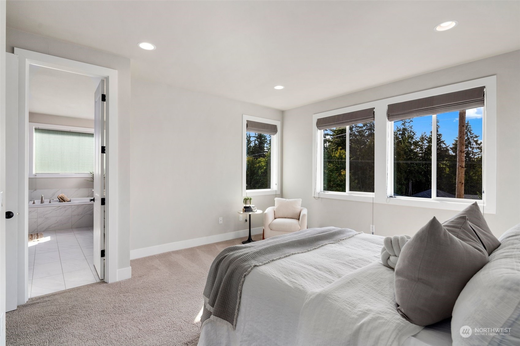 22322 43rd Drive Southeast Bothell, WA 98021 - Photo 30 of 40 a bedroom with a large bed and a large window