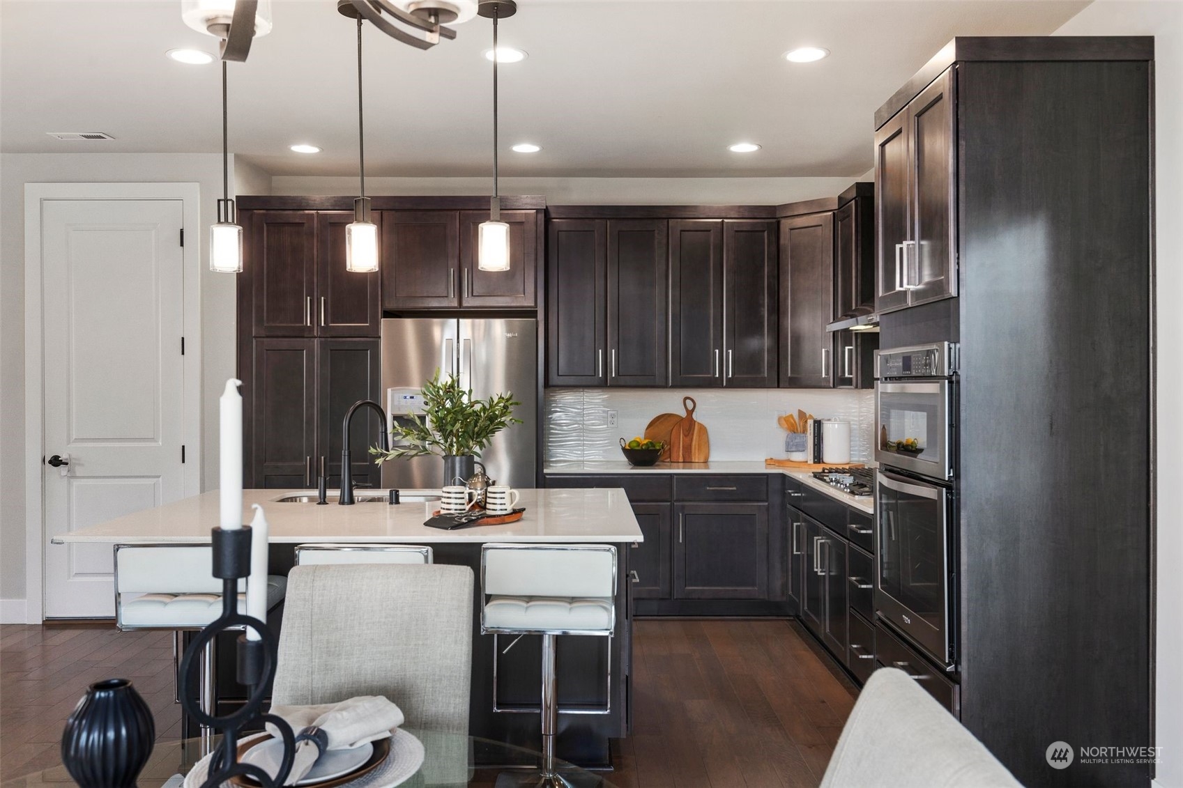 22322 43rd Drive Southeast Bothell, WA 98021 - Photo 3 of 40 a kitchen with kitchen island granite countertop a sink cabinets and stainless steel appliances