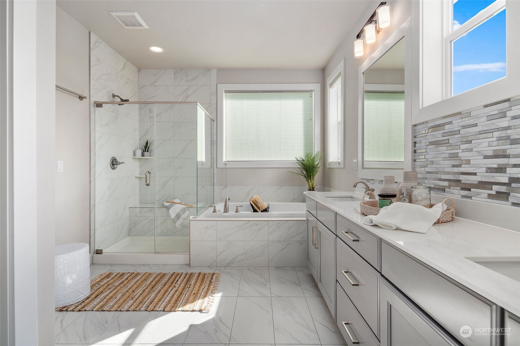 22322 43rd Drive Southeast Bothell, WA 98021 - Photo 32 of 40 a bathroom with a tub sink toilet a mirror and a tub