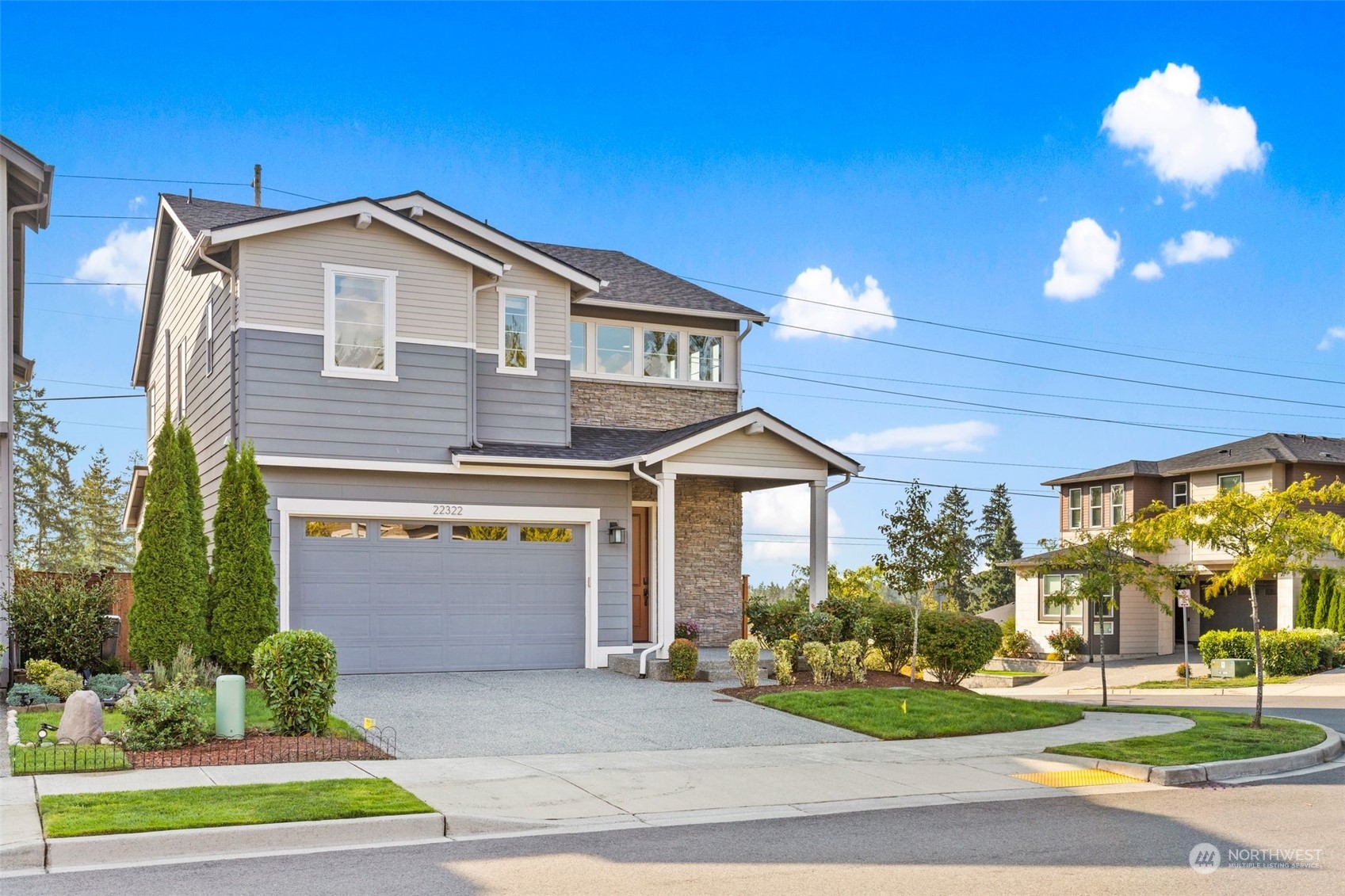 22322 43rd Drive Southeast Bothell, WA 98021 - Photo 38 of 40 a front view of a house with a yard and garage