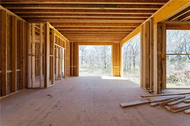 a room with a large window and a chandelier