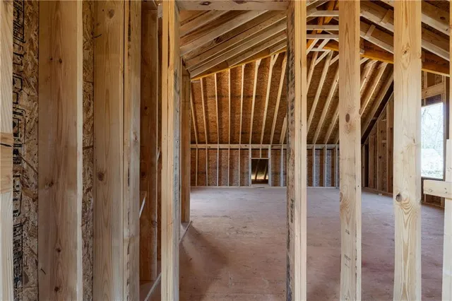 a view of entryway with wooden floor and door