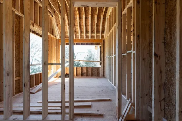 a view of a porch with wooden floor and fence