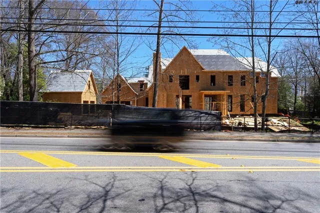 a view of multiple houses with a street