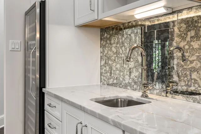 a living room with furniture and large windows