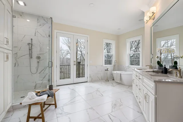 a bathroom with a double vanity sink and mirror