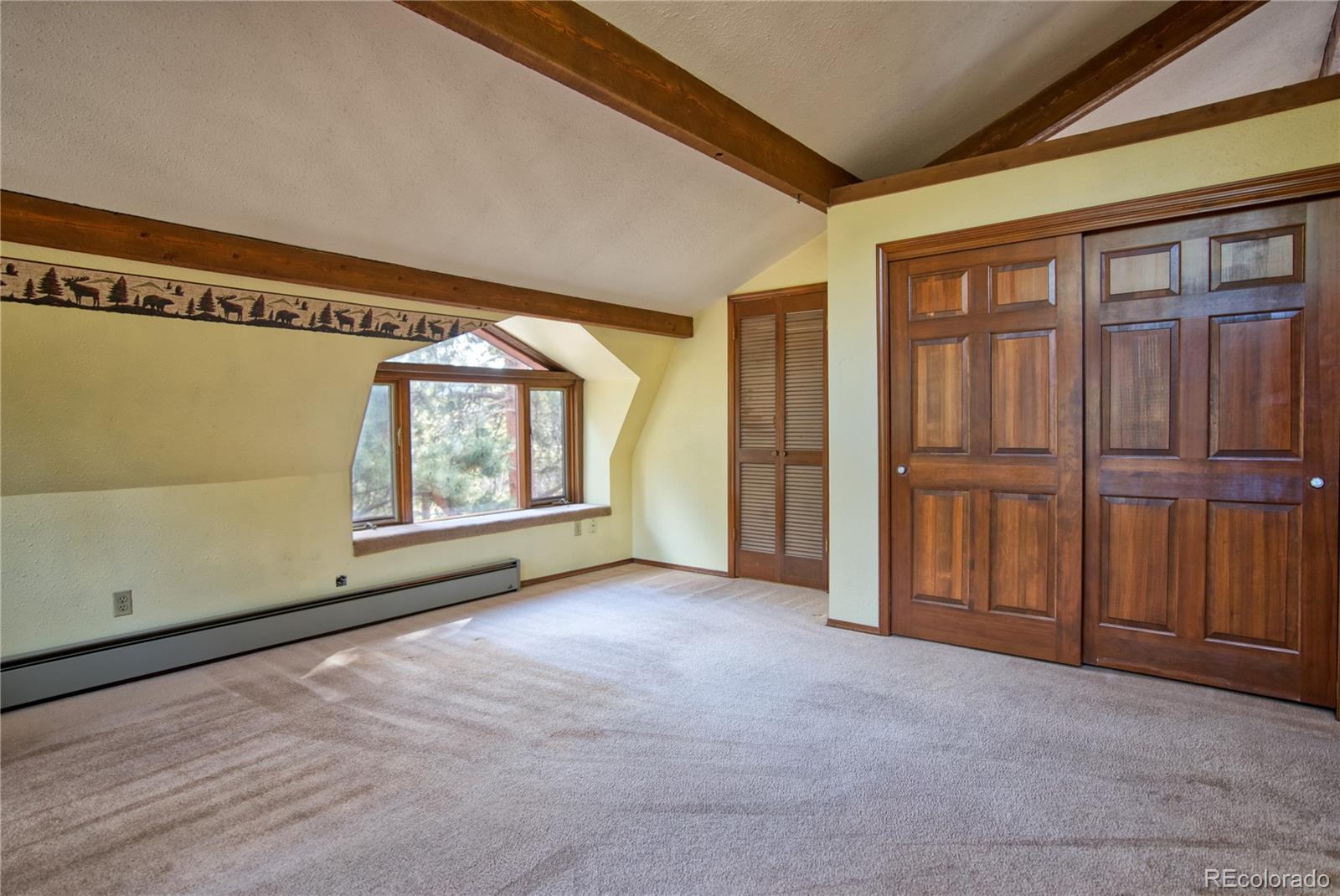 601 Pika Road Boulder, CO 80302 - Photo 18 of 30 a view of an empty room with a window