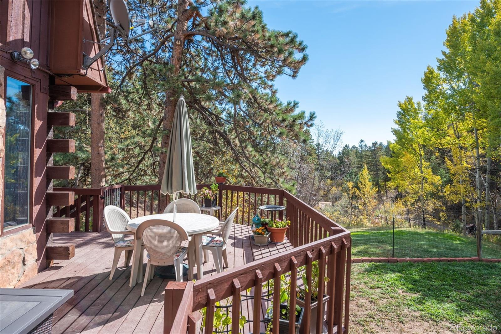 601 Pika Road Boulder, CO 80302 - Photo 25 of 30 a view of deck with furniture and trees