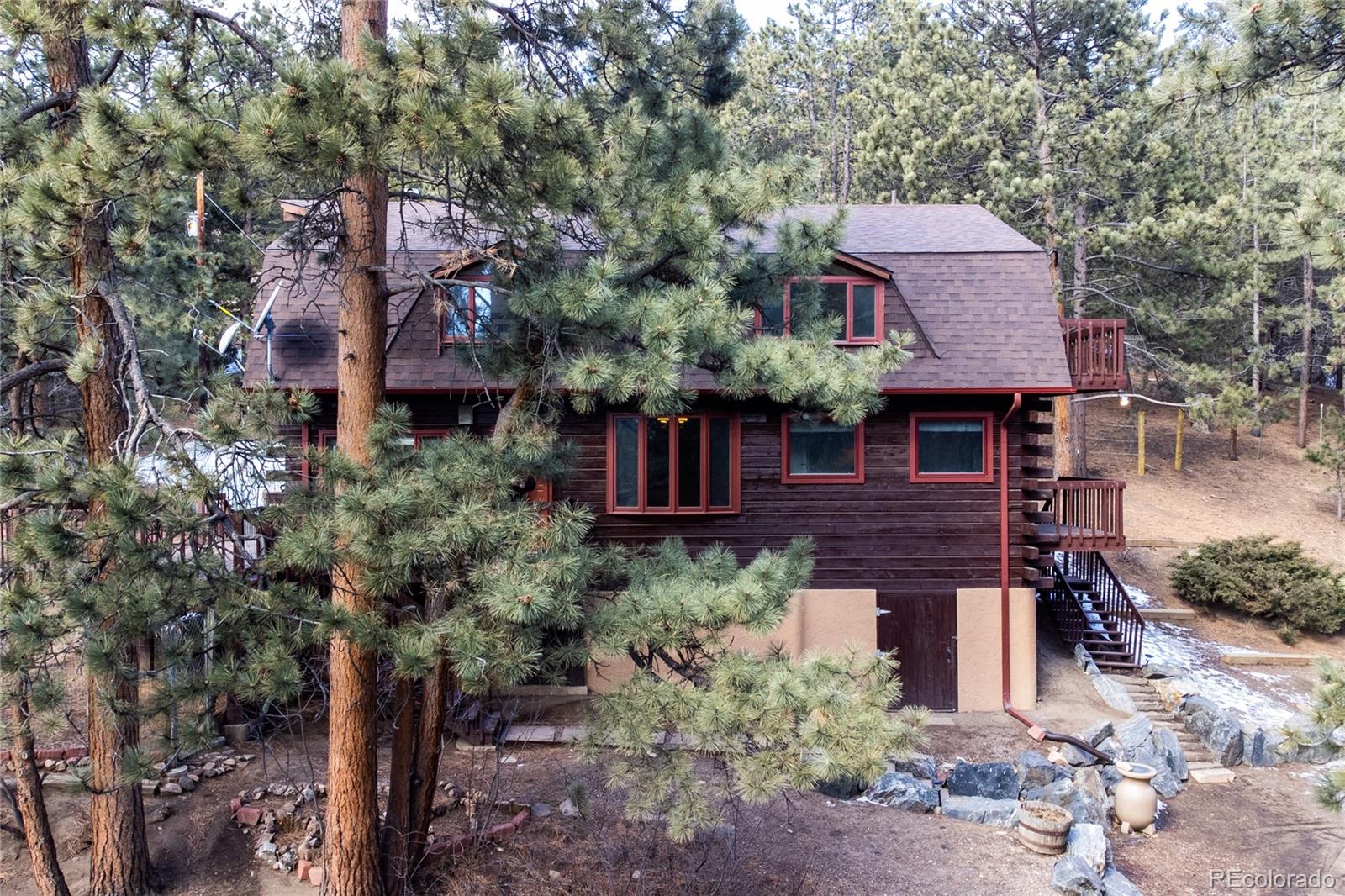 601 Pika Road Boulder, CO 80302 - Photo 4 of 30 a view of a house with a yard plants and large tree