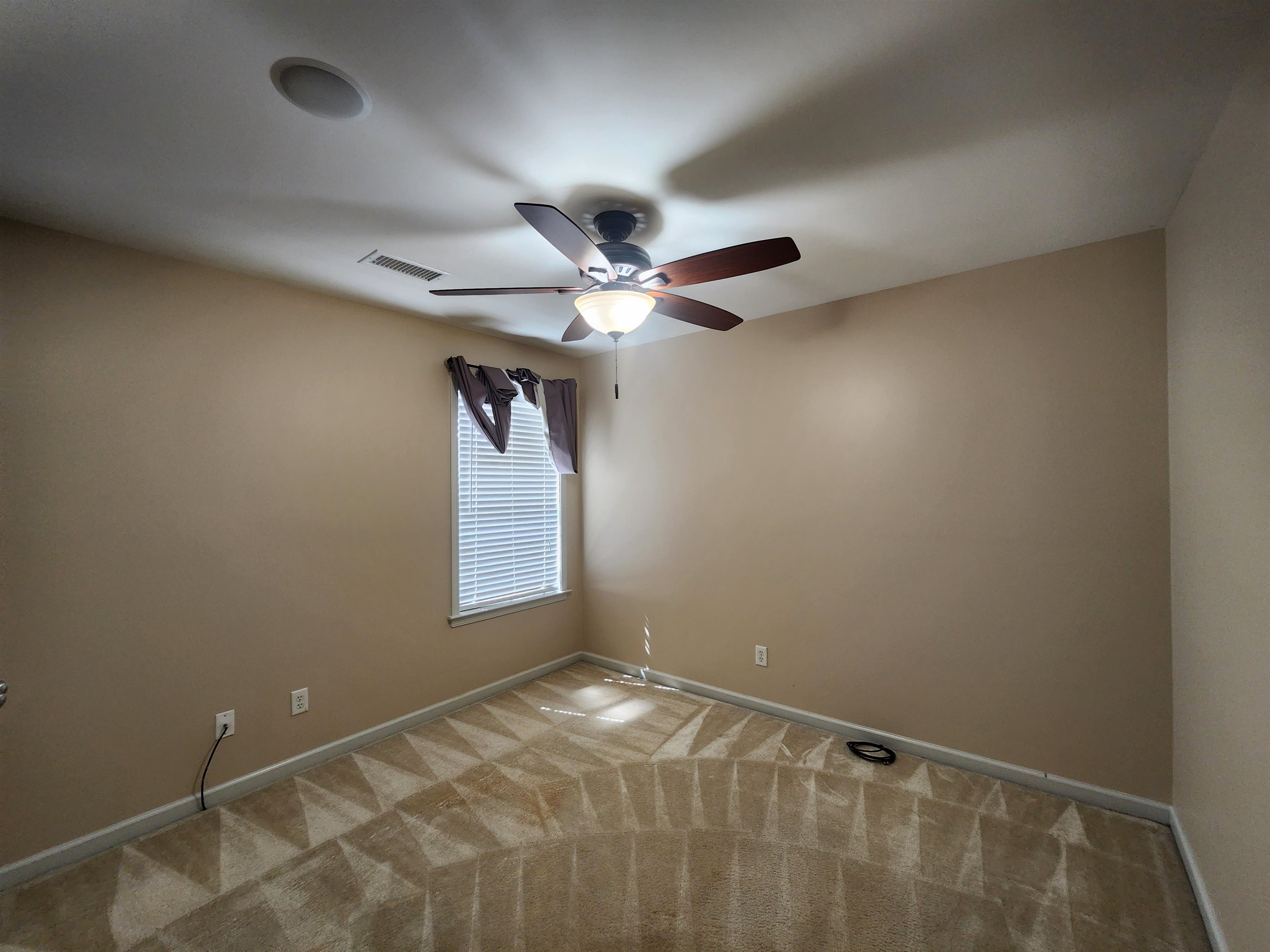 1459 Down River Drive Memphis, TN 38103 - Photo 22 of 27 Carpeted empty room with a ceiling fan, baseboards, and visible vents