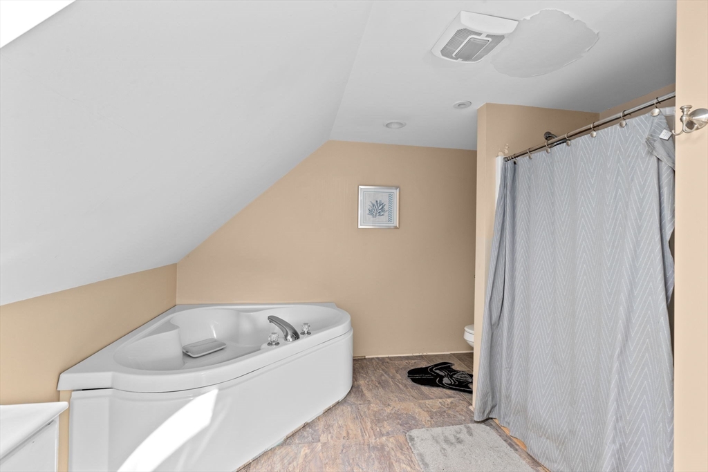 518 County Road Wareham, MA 02576 - Photo 18 of 32 a bathroom with a bathtub and a window