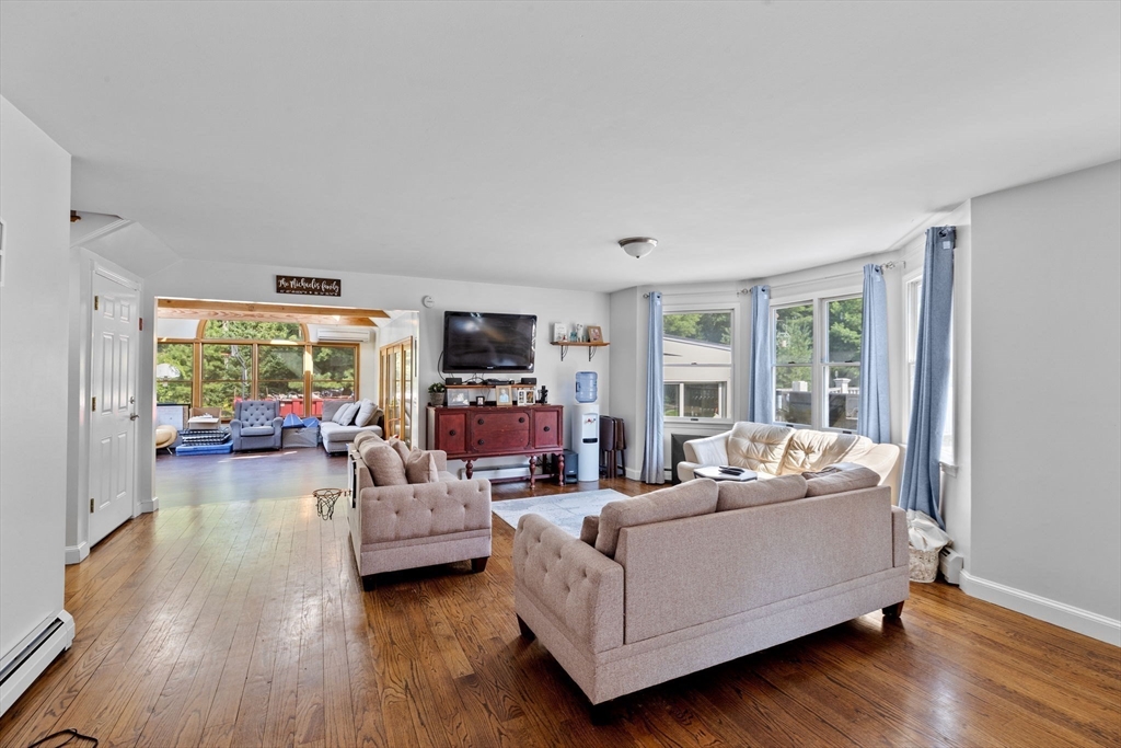 518 County Road Wareham, MA 02576 - Photo 2 of 32 a living room with furniture flat screen tv and a large window