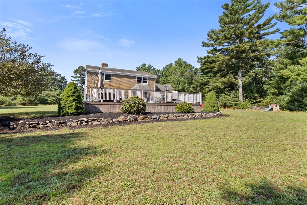 518 County Road Wareham, MA 02576 - Photo 30 of 32 a house view with swimming pool and trees in the background