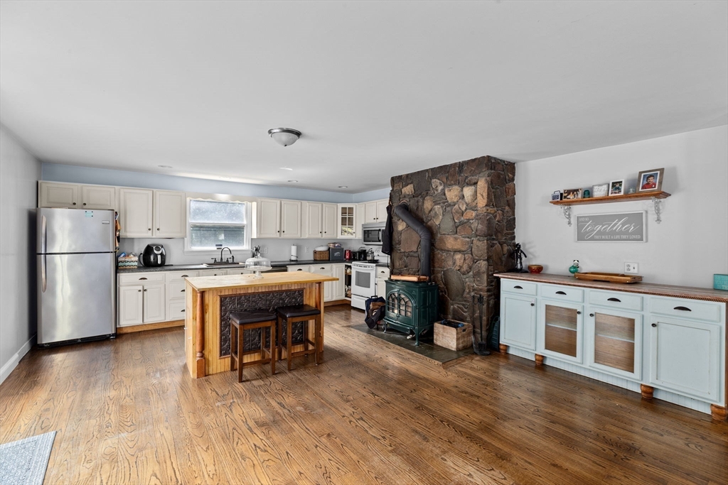 518 County Road Wareham, MA 02576 - Photo 8 of 32 a kitchen with stainless steel appliances a refrigerator a stove a sink dishwasher and a oven with wooden floor
