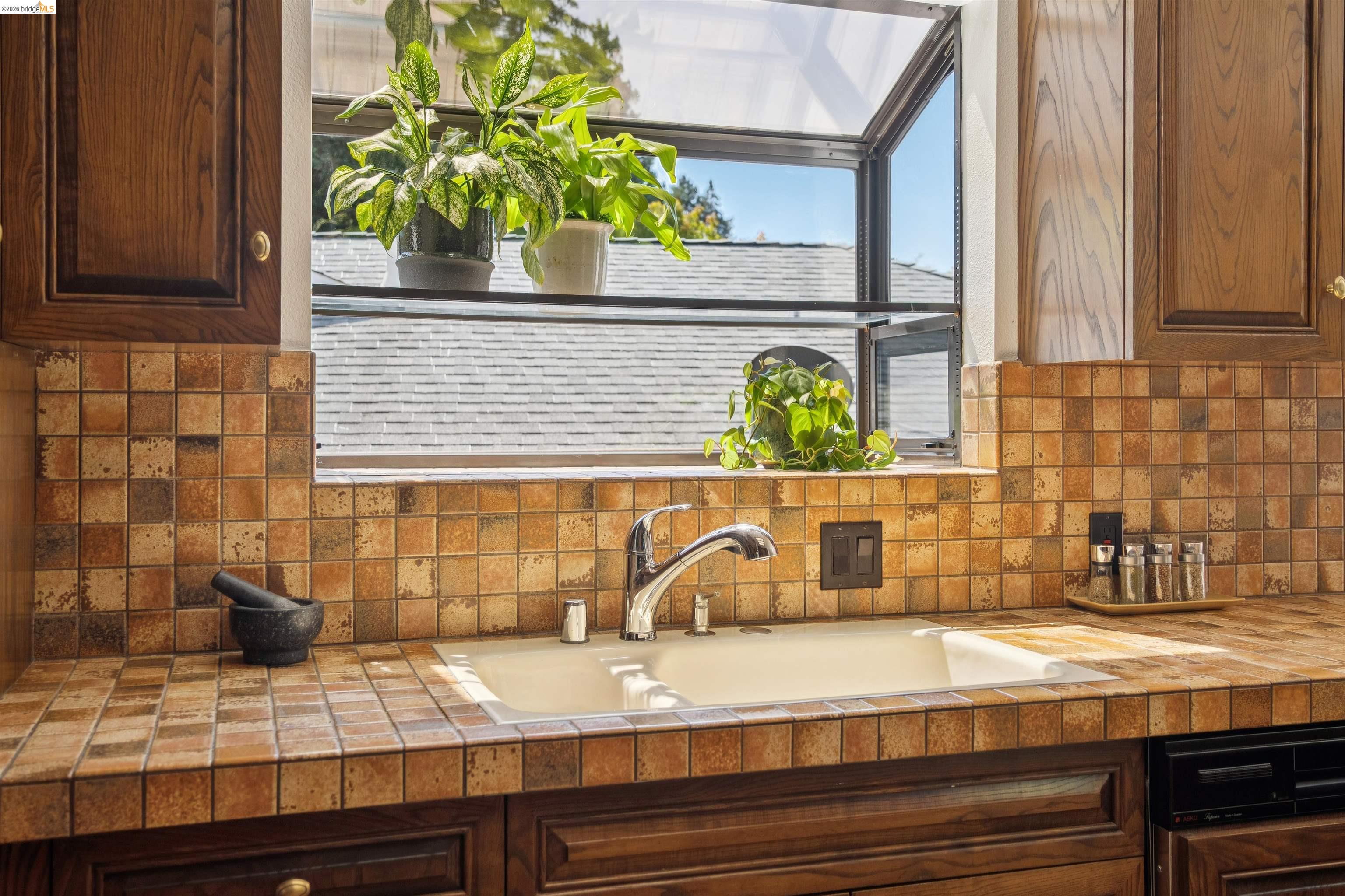 7 Jo Lin Court El Sobrante, CA 94803 - Photo 43 of 99 Kitchen window featuring an integrated dual-basin sink with a chrome faucet