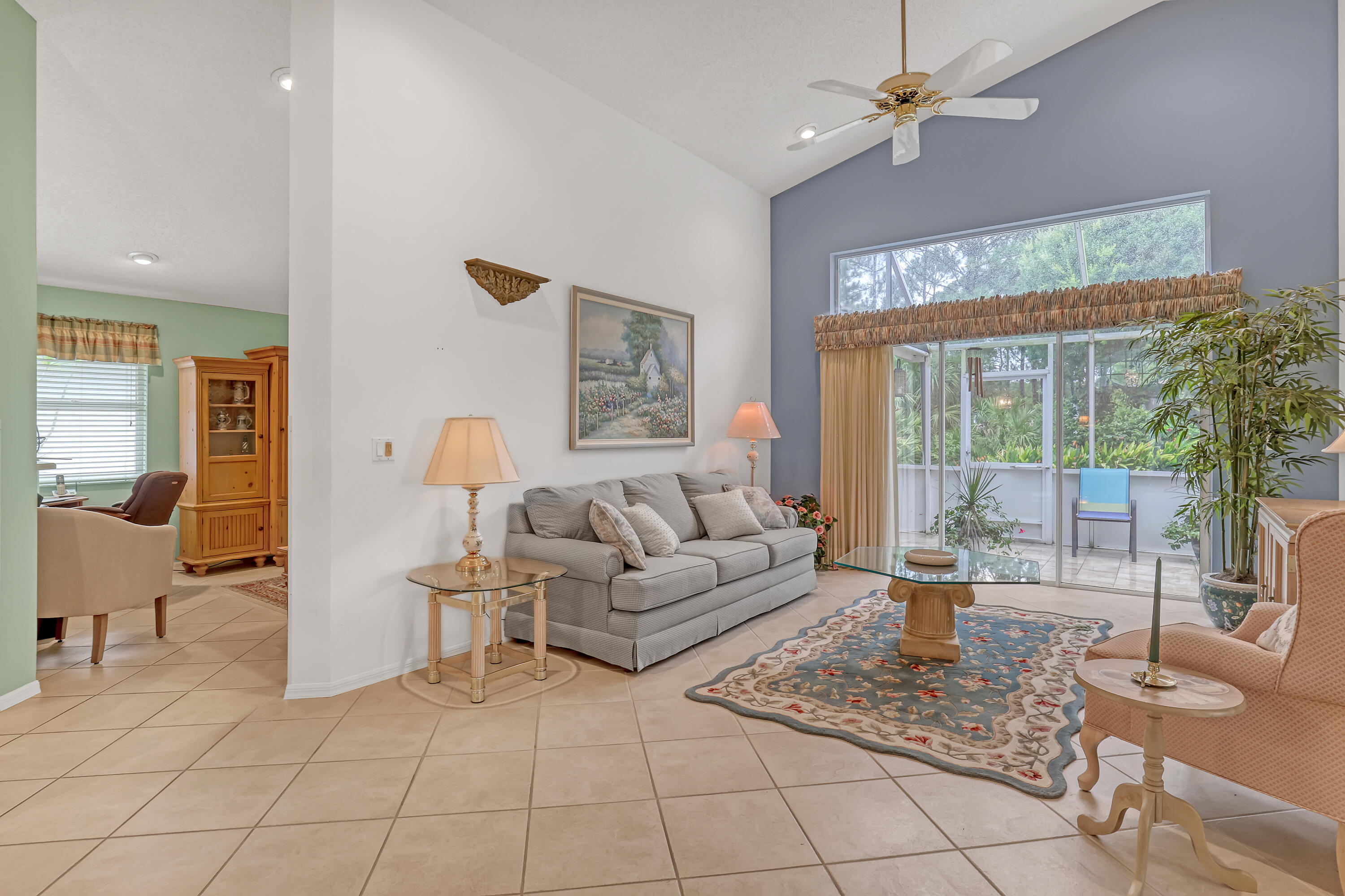 6995 Southeast Cutler Trail Stuart, FL 34997 - Photo 14 of 41 a living room with furniture and a large window