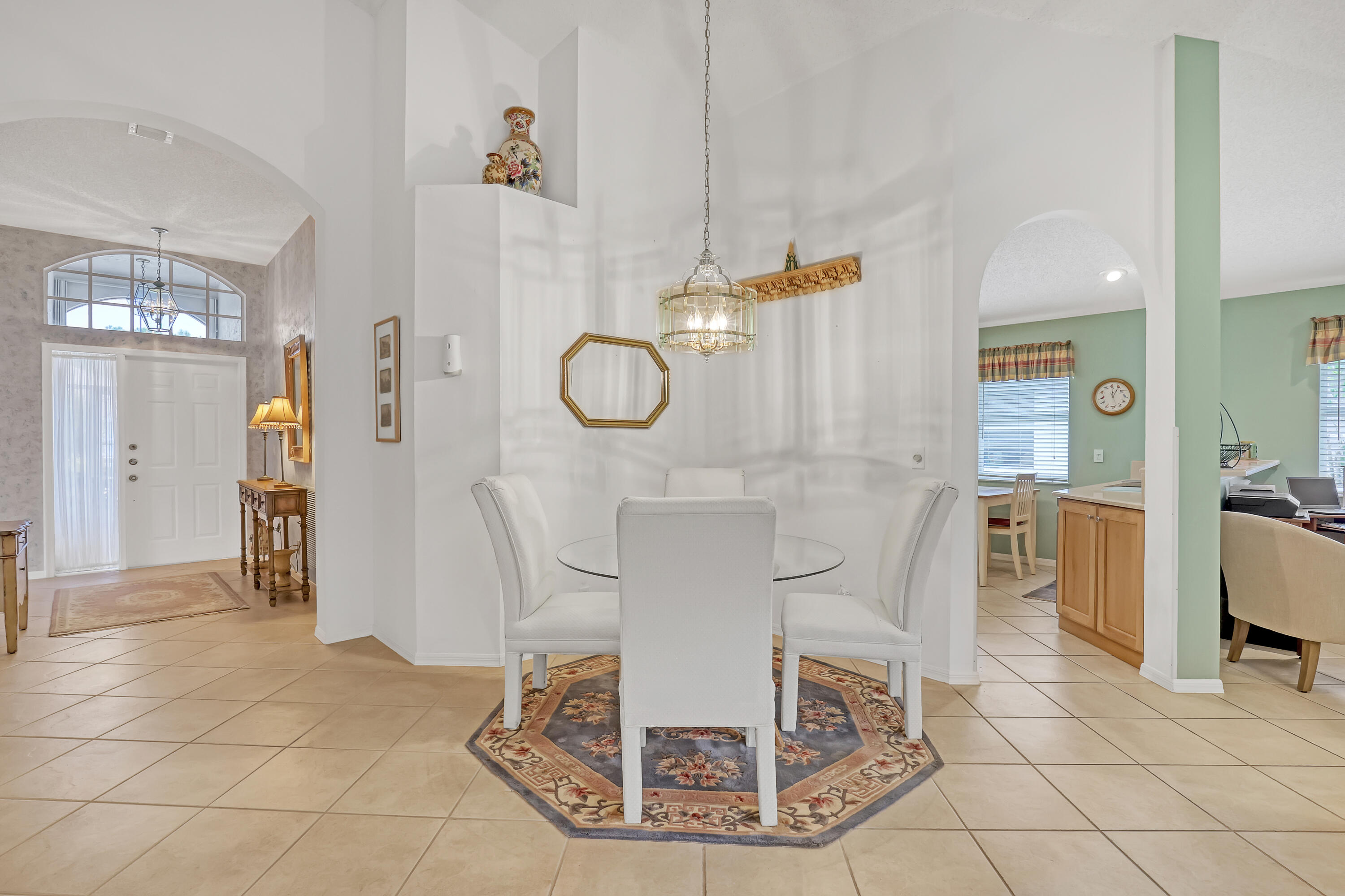 6995 Southeast Cutler Trail Stuart, FL 34997 - Photo 19 of 41 a view of a livingroom with furniture and a chandelier