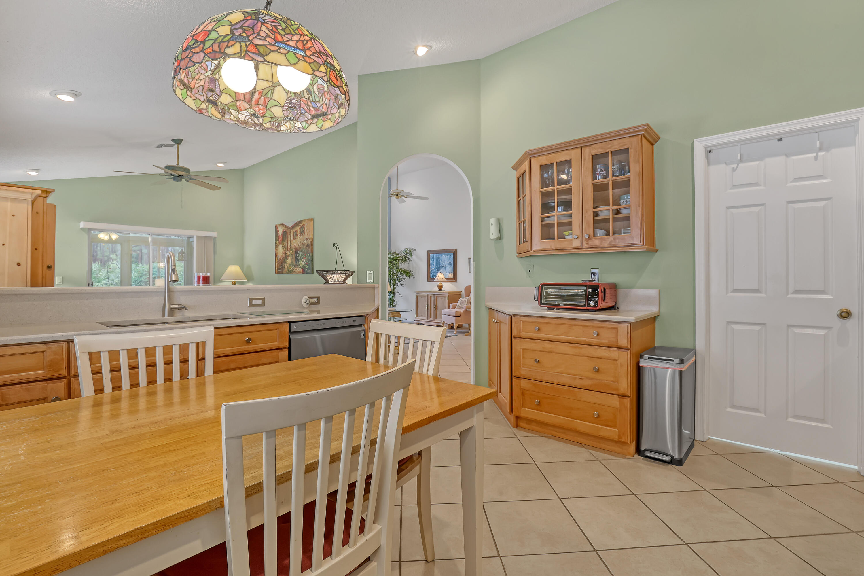 6995 Southeast Cutler Trail Stuart, FL 34997 - Photo 9 of 41 a kitchen with cabinets and window
