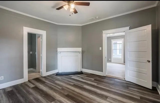 a view of a livingroom with wooden floor and closet