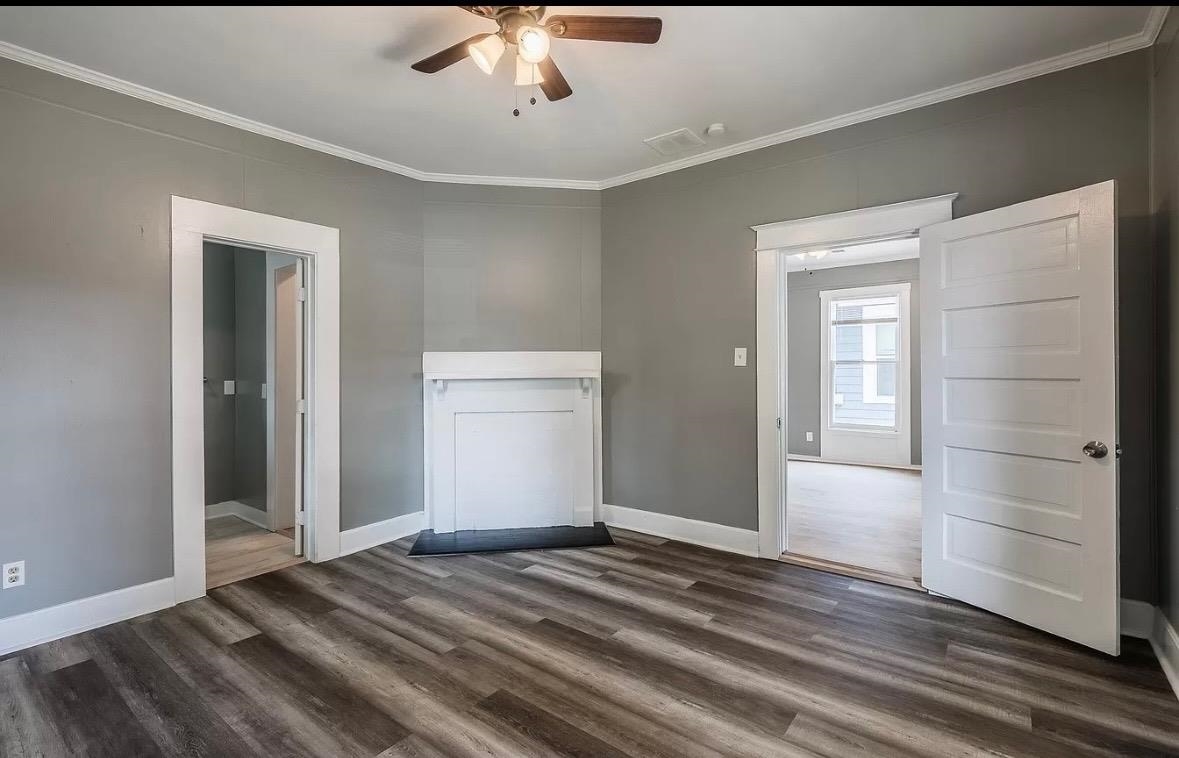 1033 Bruce Street Memphis, TN 38104 - Photo 6 of 9 a view of a livingroom with wooden floor and closet