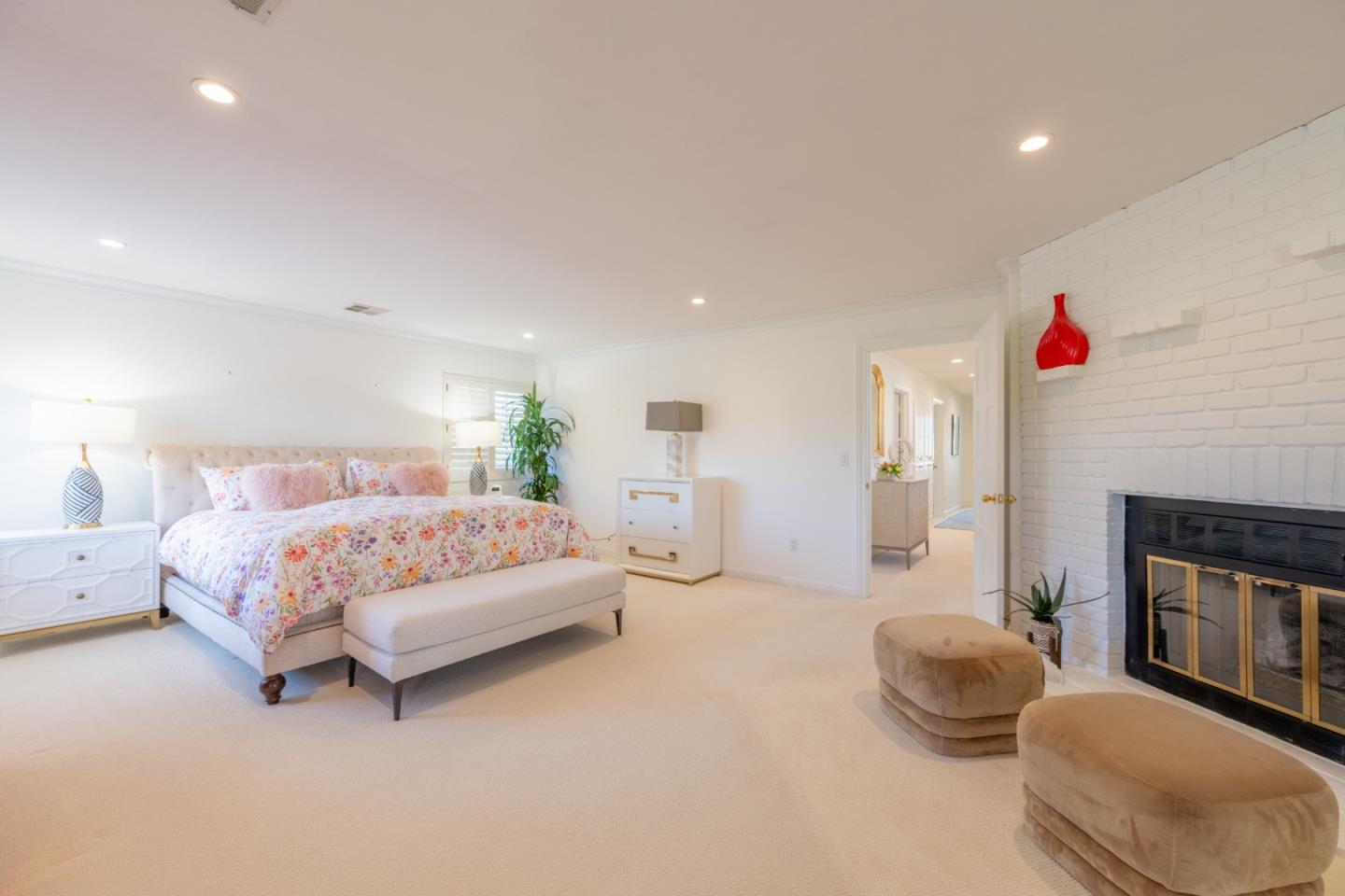 1043 Broncho Road Pebble Beach, CA 93953 - Photo 12 of 21 a bedroom with a bed and a fireplace
