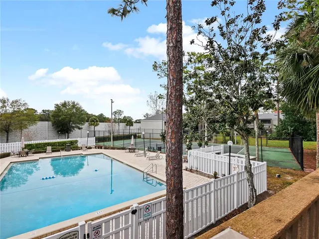 a view of a balcony with yard