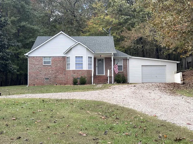 a view of a yard in front of a house with a yard