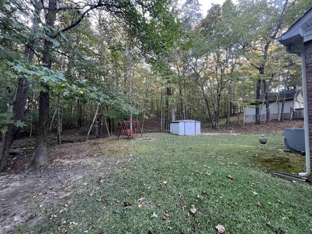 a backyard of a house with lots of green space