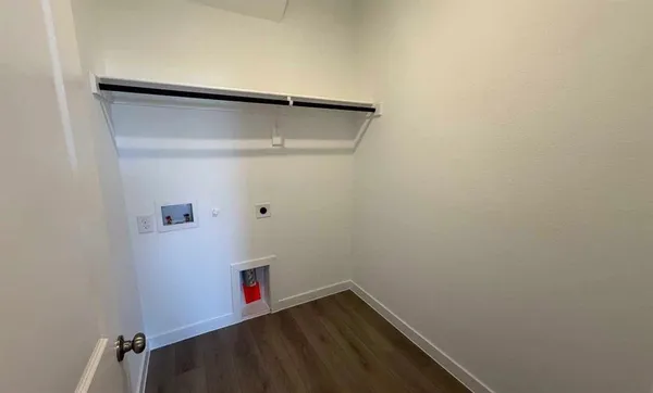 a kitchen with a sink a microwave a stove and refrigerator