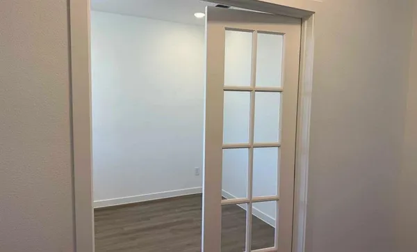 a view of entryway with wooden floor