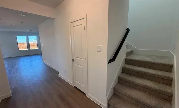 a large kitchen with kitchen island a sink stainless steel appliances and a counter top space