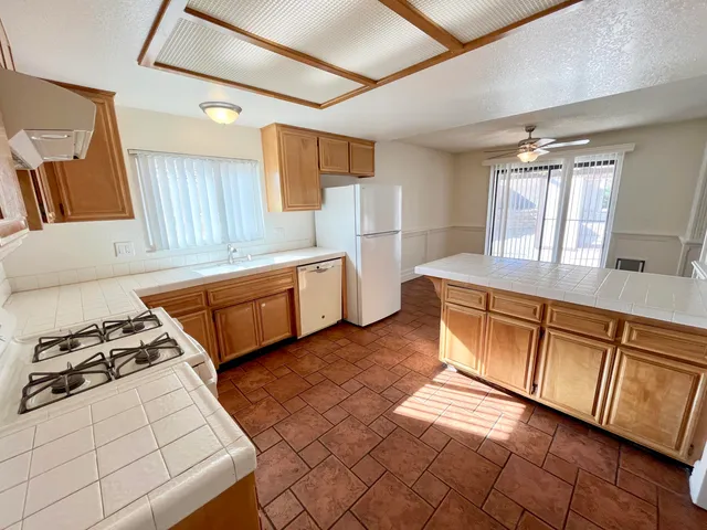 a view of livingroom with hardwood floor and a ceiling fan
