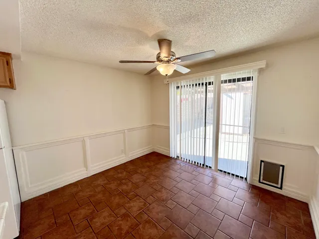 a view of a kitchen with a sink and a window
