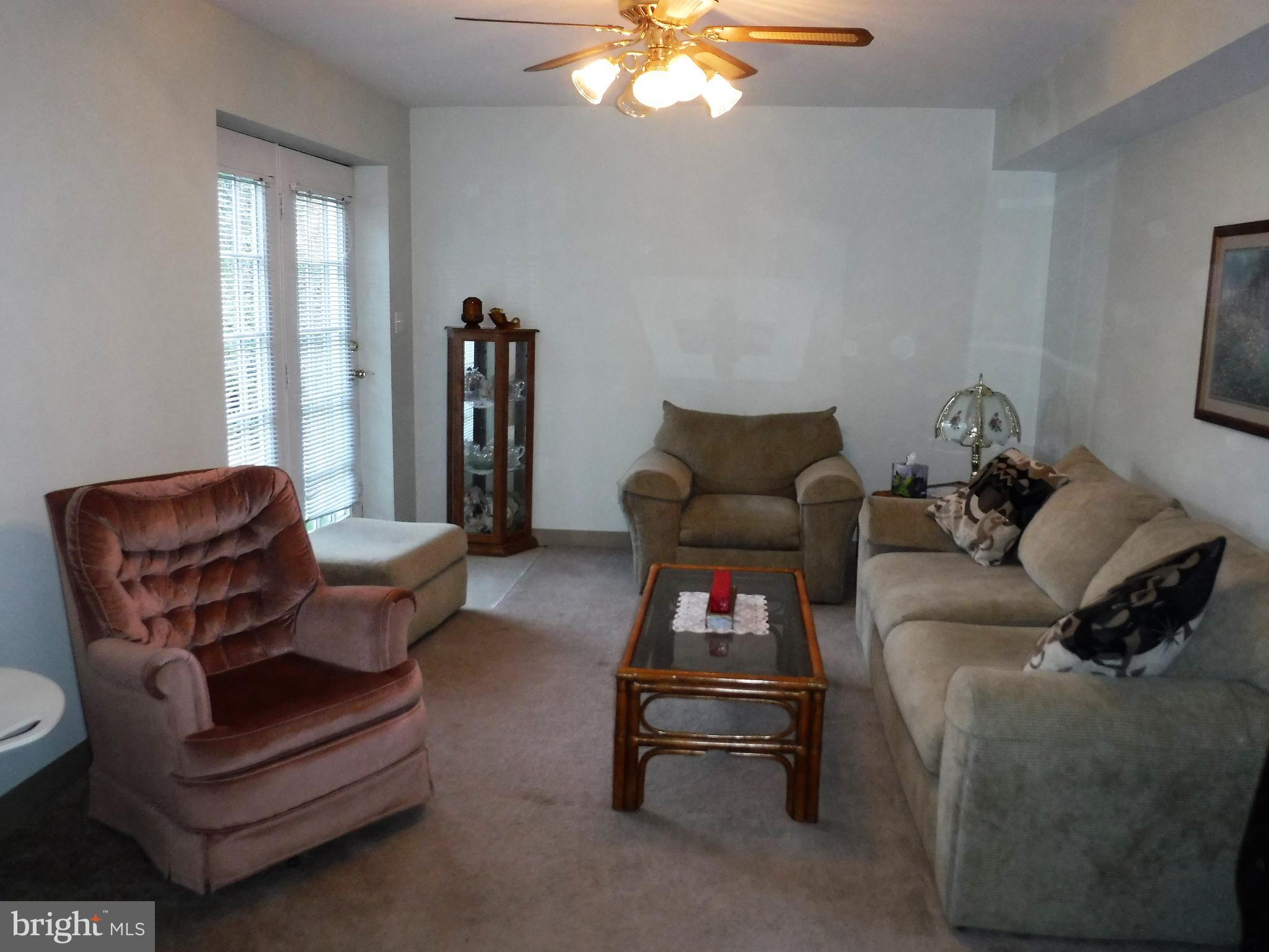 1222 Furnace Road Linthicum Heights, MD 21090 - Photo 3 of 9 a living room with furniture and white walls