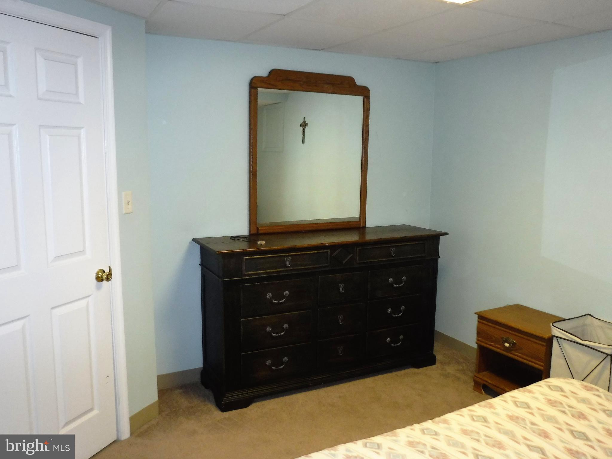 1222 Furnace Road Linthicum Heights, MD 21090 - Photo 7 of 9 a room with a bed and a mirror