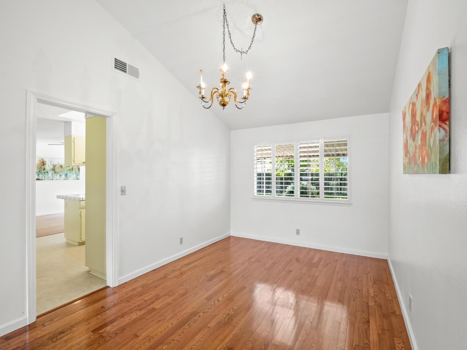 873 Cedar Lane Lemoore, CA 93245 - Photo 14 of 41 a view of an empty room with a window