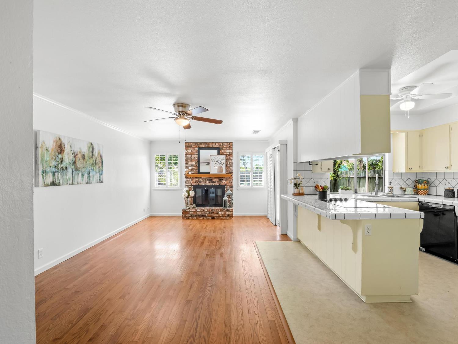 873 Cedar Lane Lemoore, CA 93245 - Photo 17 of 41 a kitchen with sink and wooden floor
