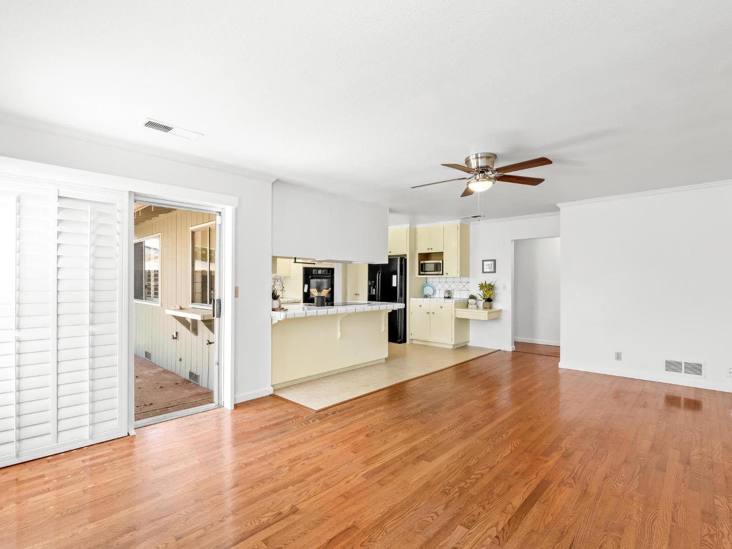 873 Cedar Lane Lemoore, CA 93245 - Photo 20 of 41 a view of a kitchen with wooden floor and a kitchen