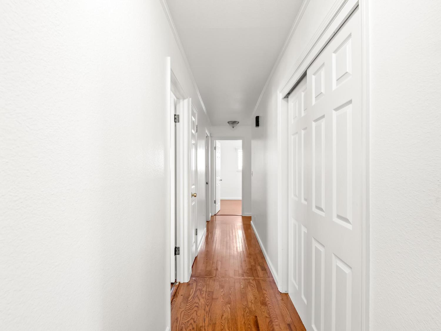 873 Cedar Lane Lemoore, CA 93245 - Photo 24 of 41 a view of a hallway with wooden floor