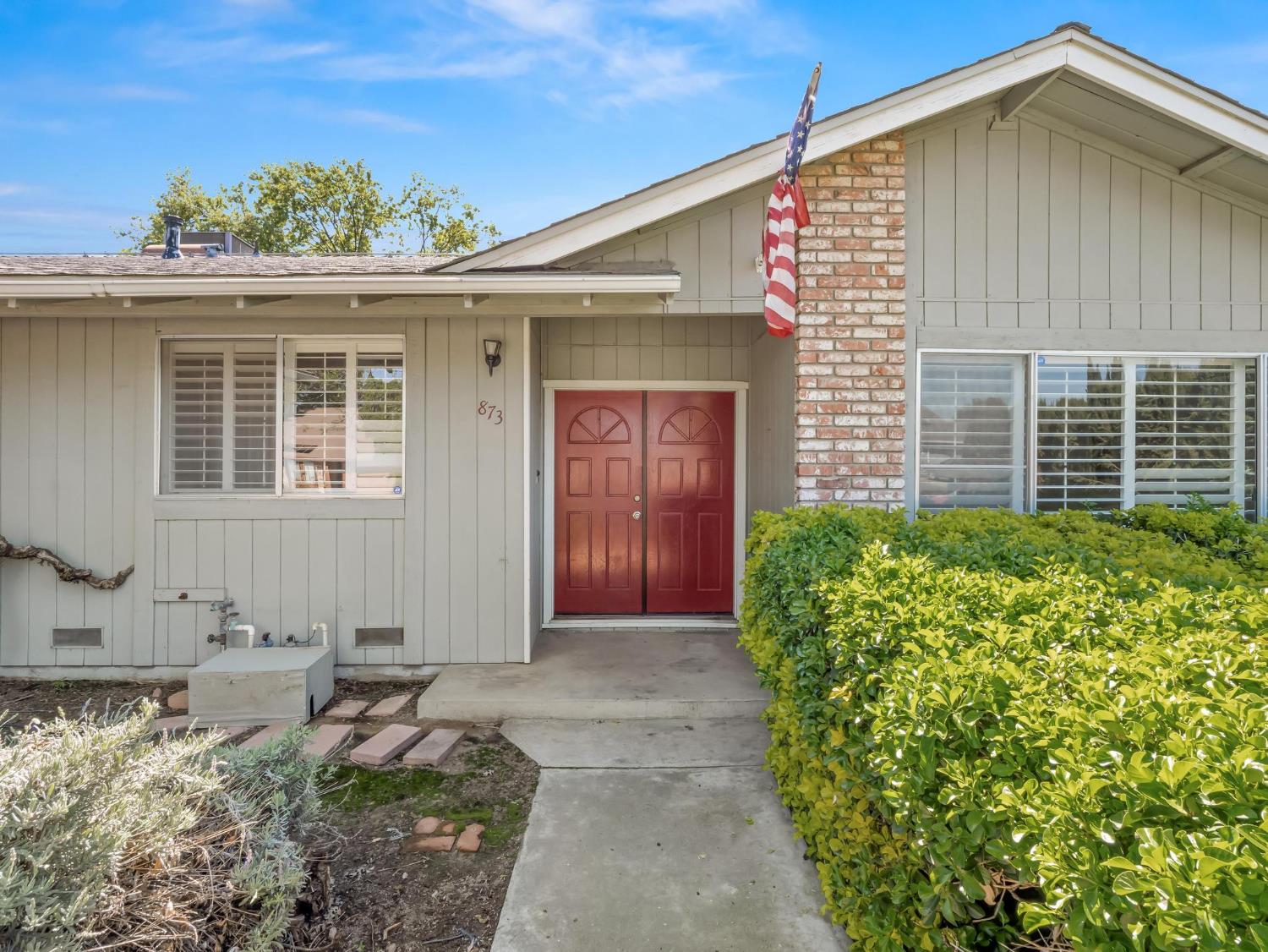 873 Cedar Lane Lemoore, CA 93245 - Photo 3 of 41 a front view of a house with garden