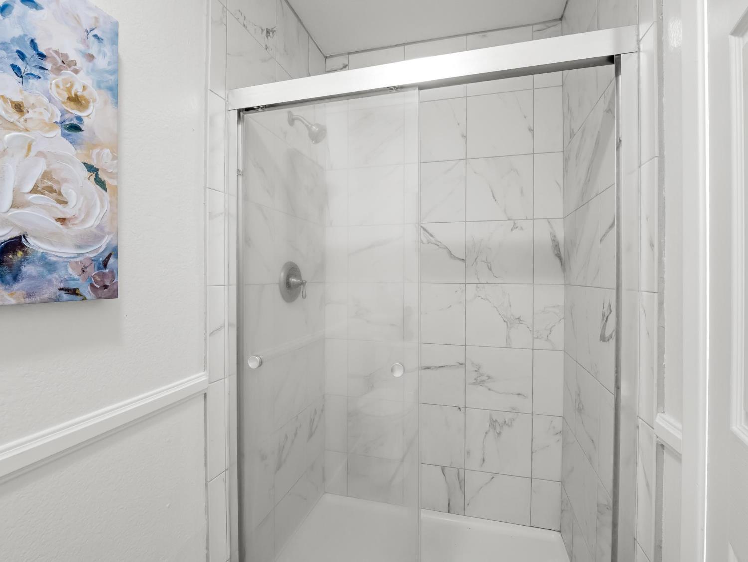 873 Cedar Lane Lemoore, CA 93245 - Photo 31 of 41 a bathroom with a shower