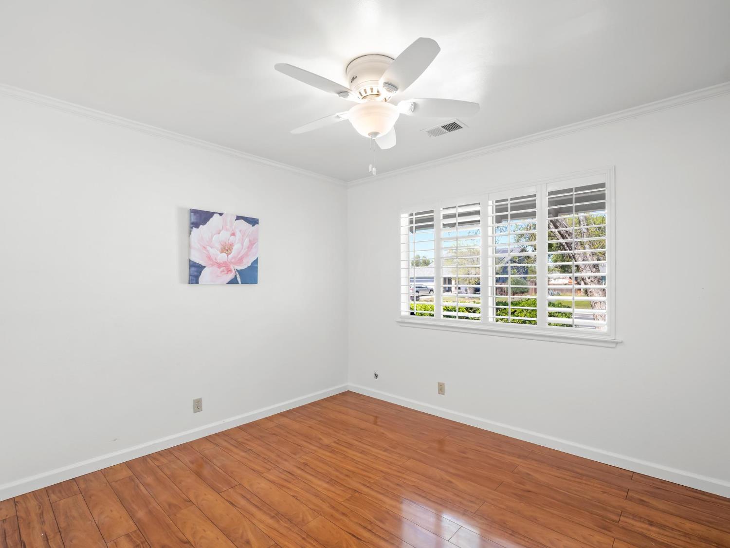 873 Cedar Lane Lemoore, CA 93245 - Photo 32 of 41 wooden floor in an empty room with a window