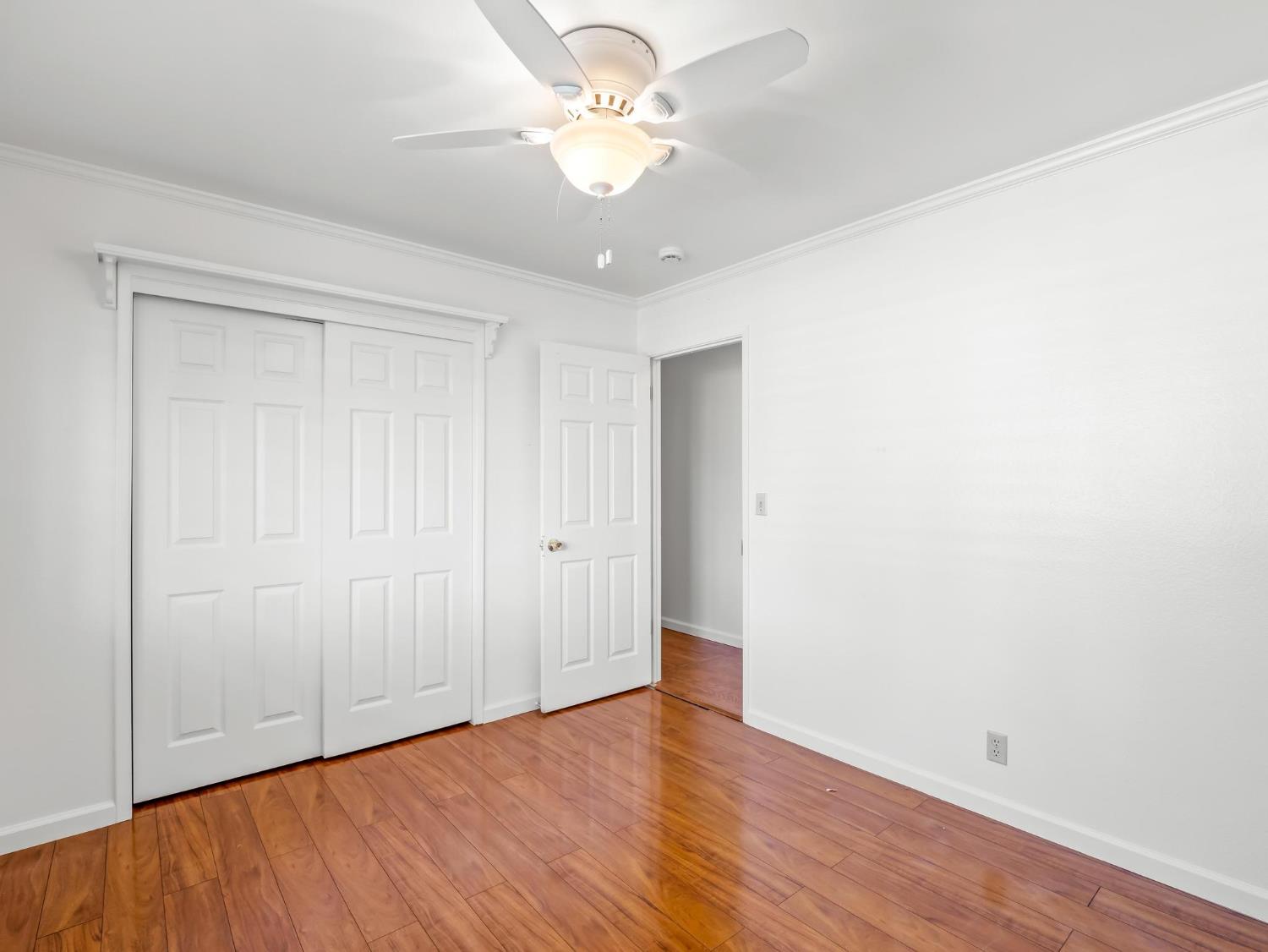 873 Cedar Lane Lemoore, CA 93245 - Photo 34 of 41 a view of an empty room with wooden floor