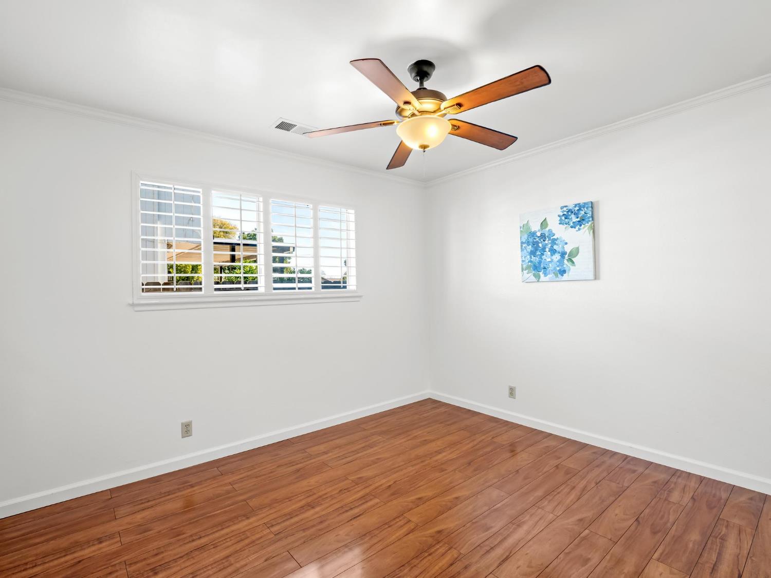 873 Cedar Lane Lemoore, CA 93245 - Photo 35 of 41 a view of empty room with wooden floor and fan